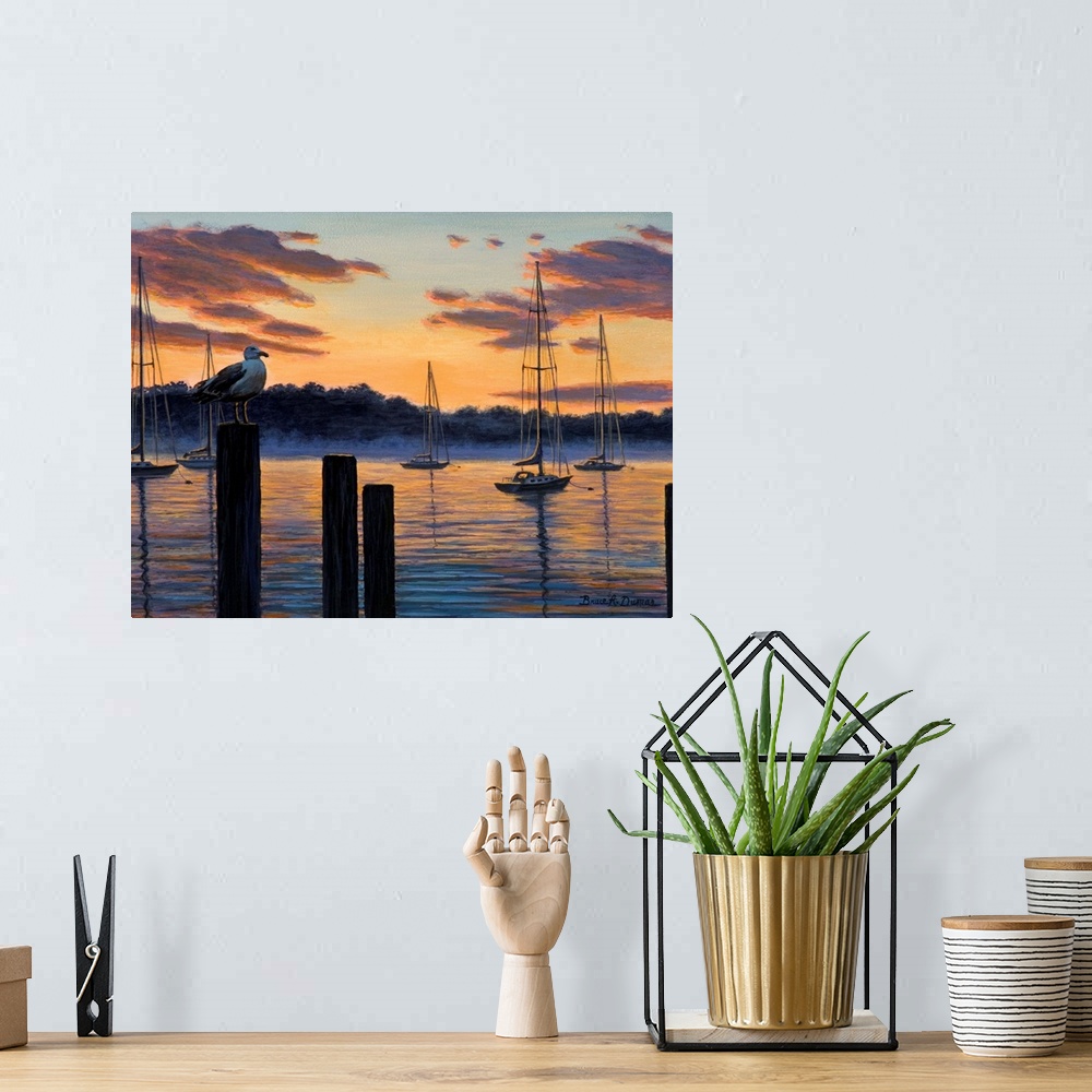 A bohemian room featuring Contemporary artwork of seagull and sailboats at sunset.