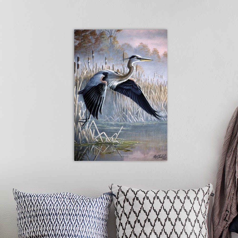 A bohemian room featuring Heron taking off over water.