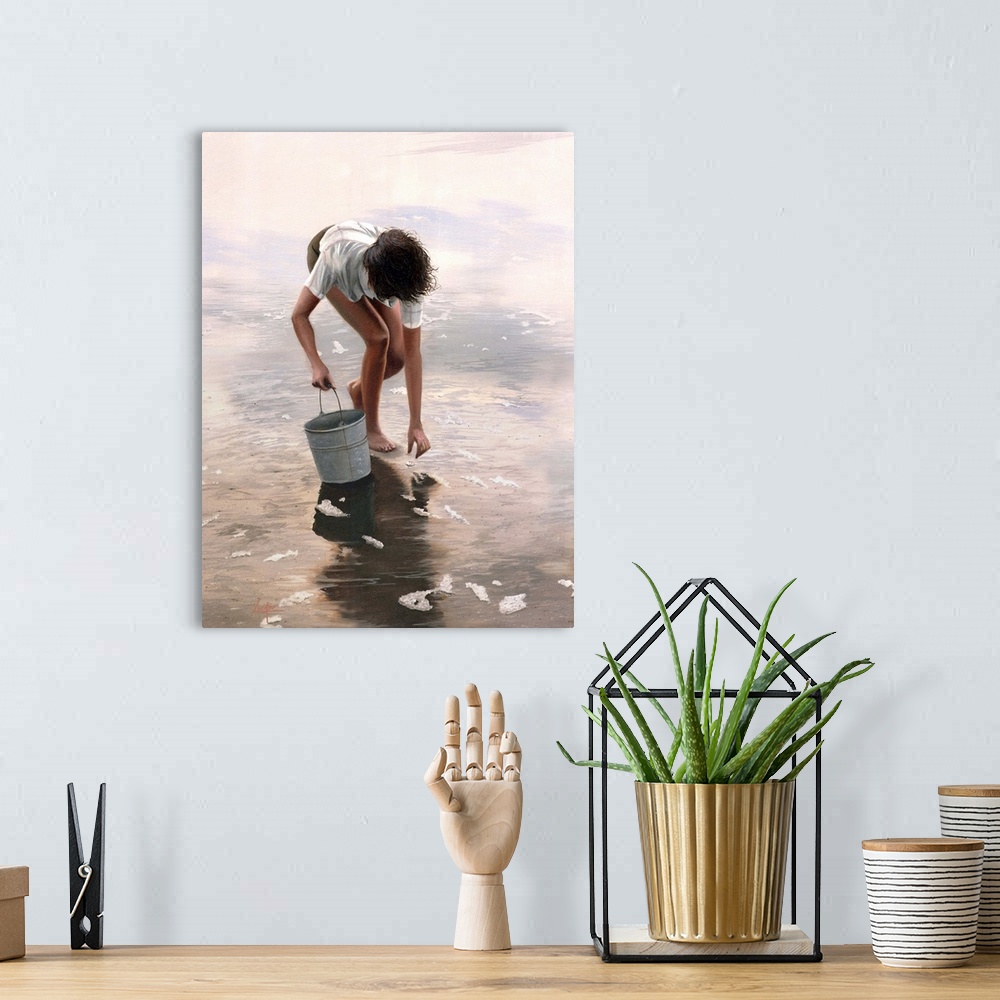 A bohemian room featuring Child holding bucket crouching in water to retrieve shell.