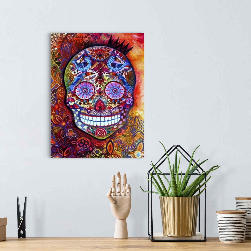A bohemian room featuring Watercolor painting of a brightly patterned Day of the Dead sugar skull.