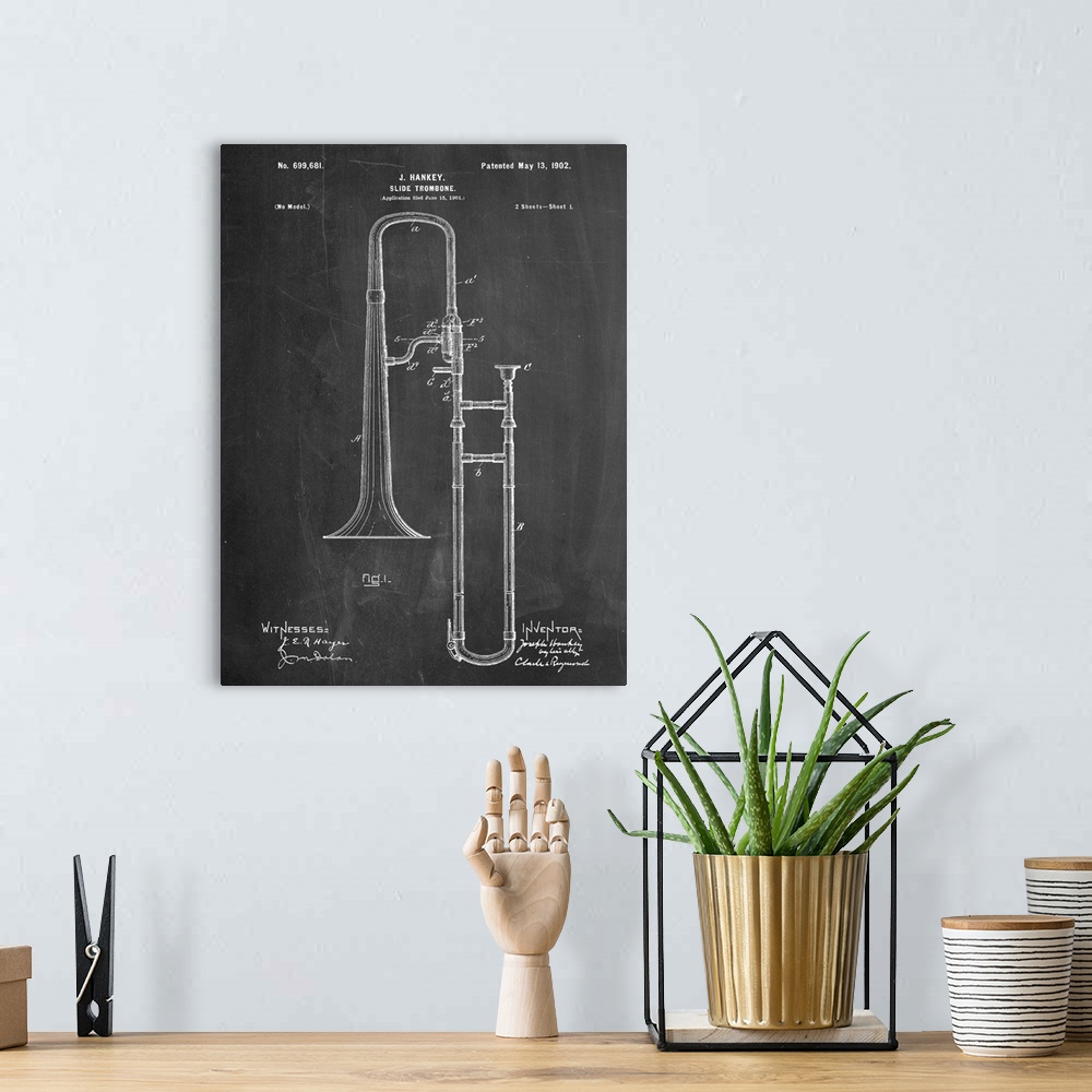 A bohemian room featuring Black and white diagram showing the parts of a slide trombone.
