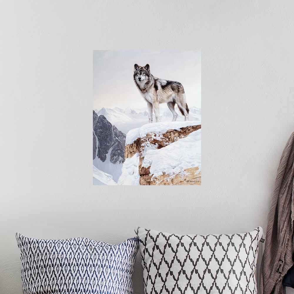 A bohemian room featuring A wolf stands on a snowy cliff face, silhouetted against the winter sky.