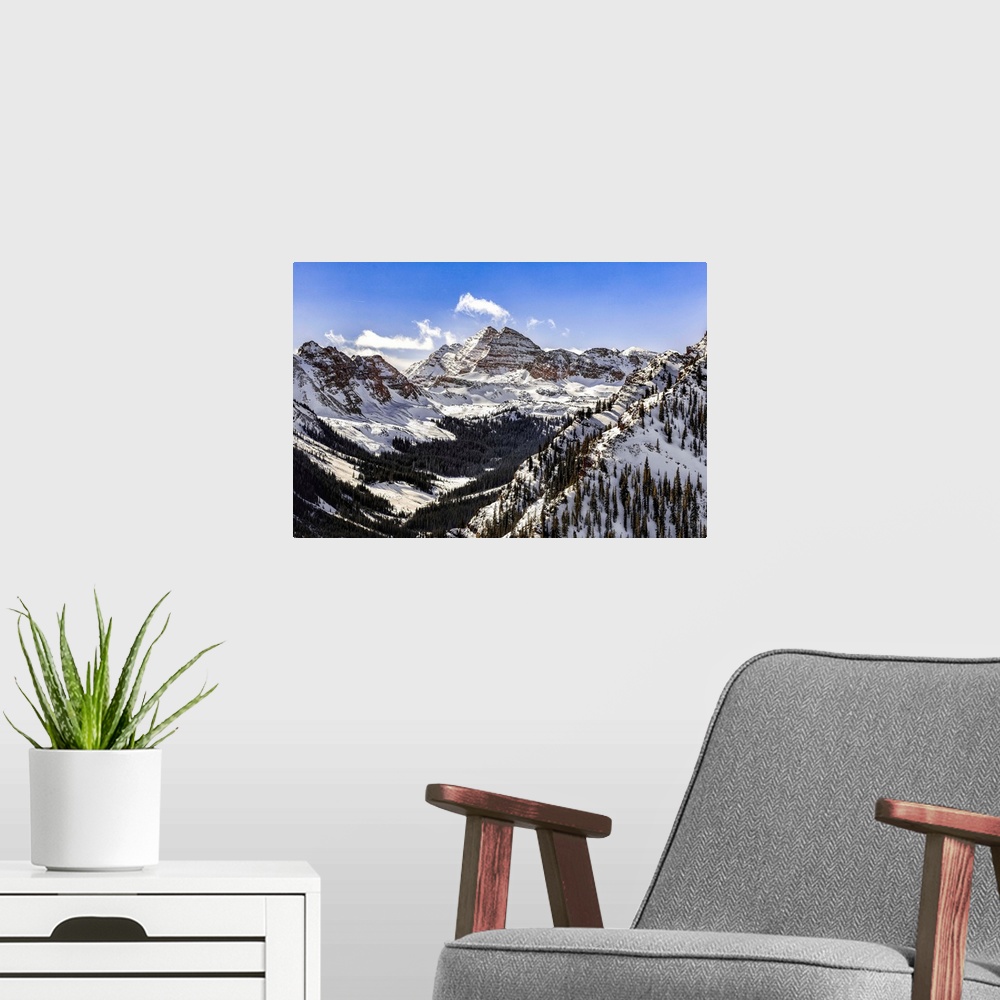 A modern room featuring Snow Covered Maroon Bells