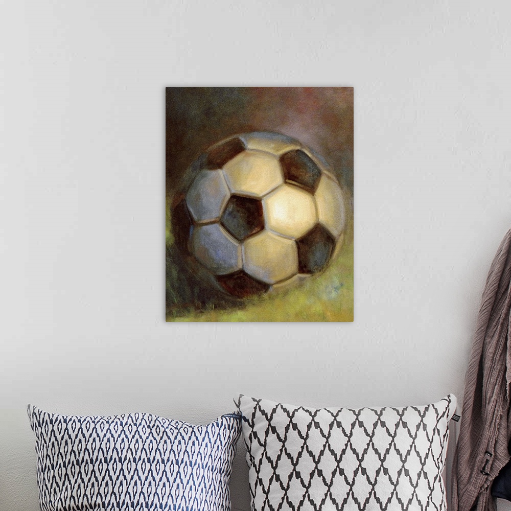 A bohemian room featuring Contemporary still-life painting of a soccer ball sitting on grass.