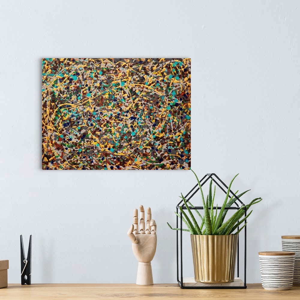 A bohemian room featuring Contemporary abstract painting made of paint splatters and swirls.