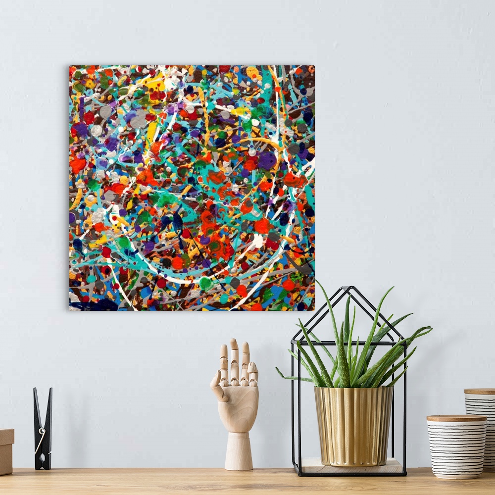 A bohemian room featuring Contemporary abstract painting made of multicolored paint splatters and swirls.