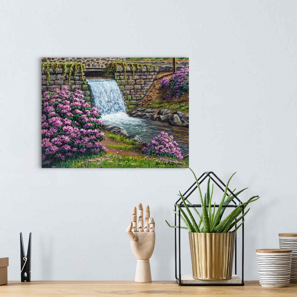 A bohemian room featuring Contemporary artwork of a small waterfall with purple flowers around it.