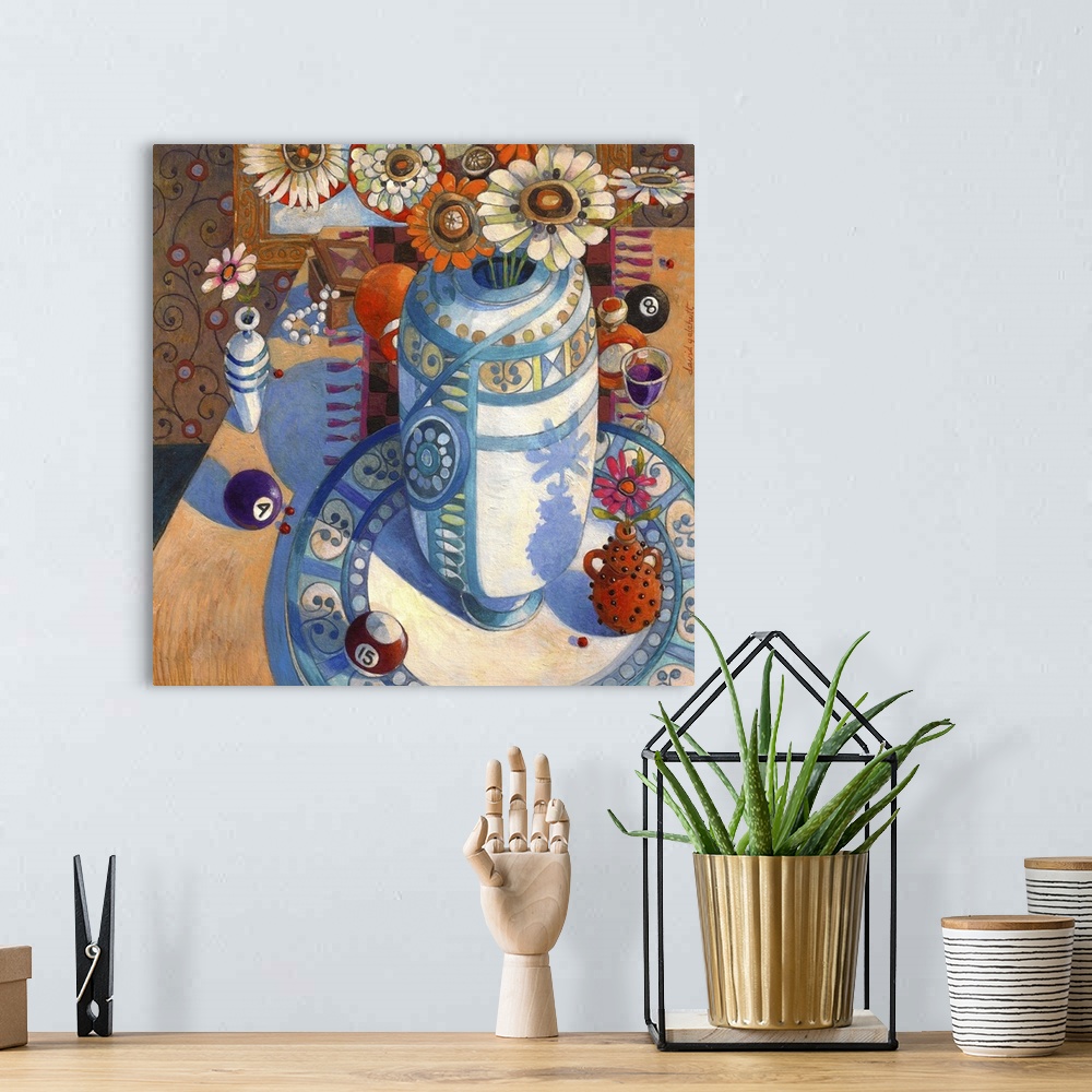 A bohemian room featuring Contemporary artwork of a still life of a vase and some flowers. With some billiard balls.