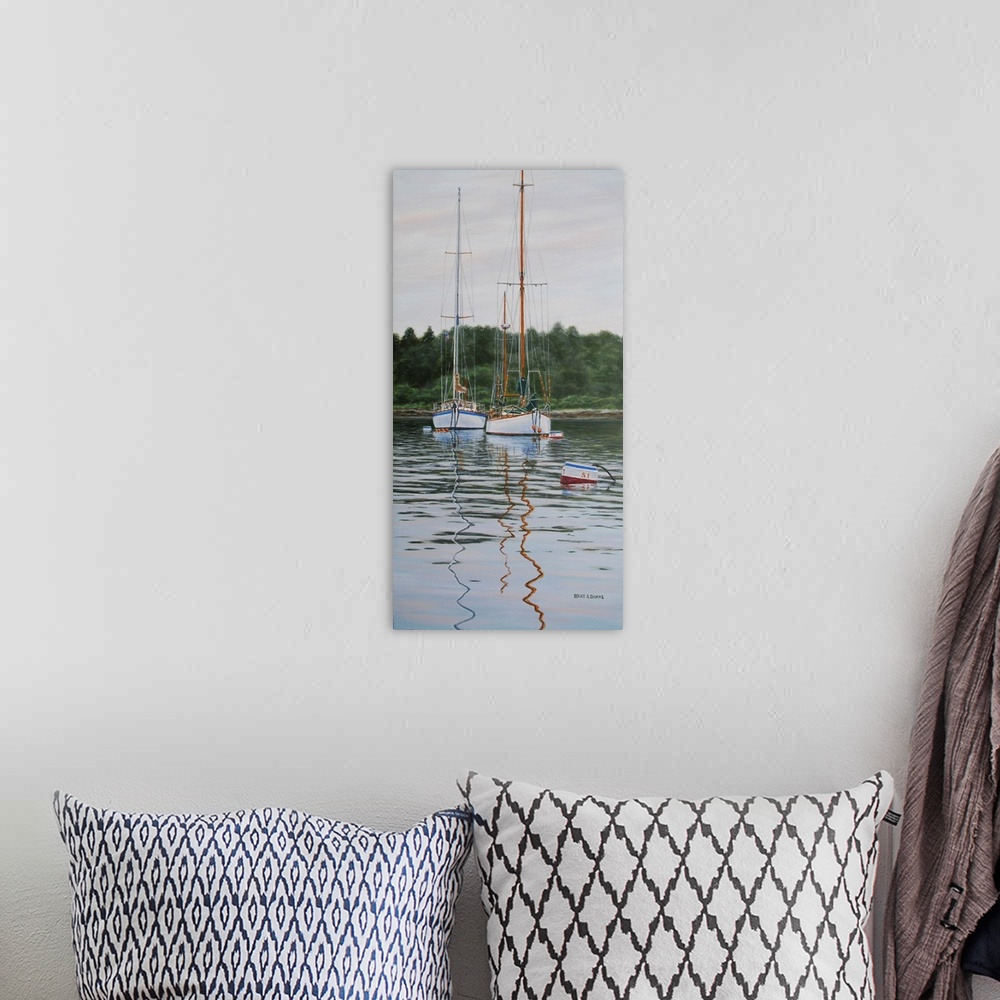 A bohemian room featuring Contemporary artwork of two tall sailboats in the water.