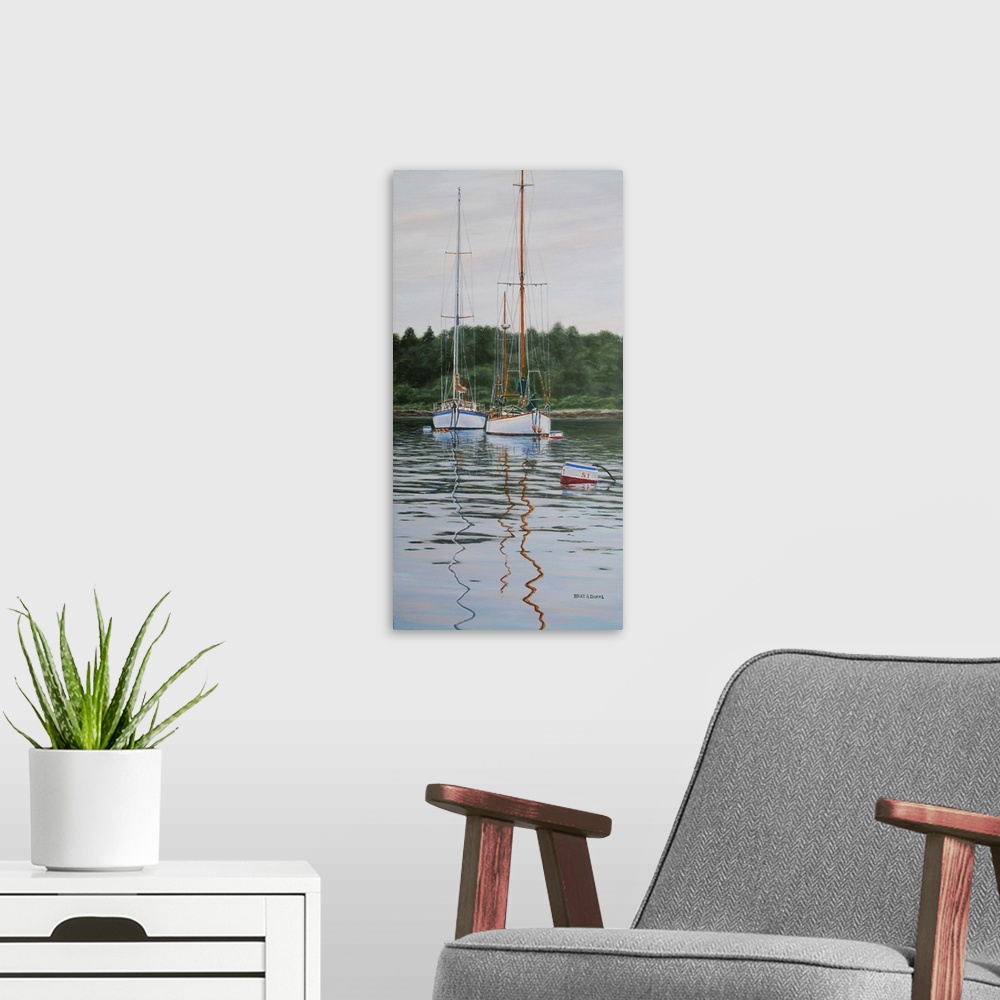 A modern room featuring Contemporary artwork of two tall sailboats in the water.