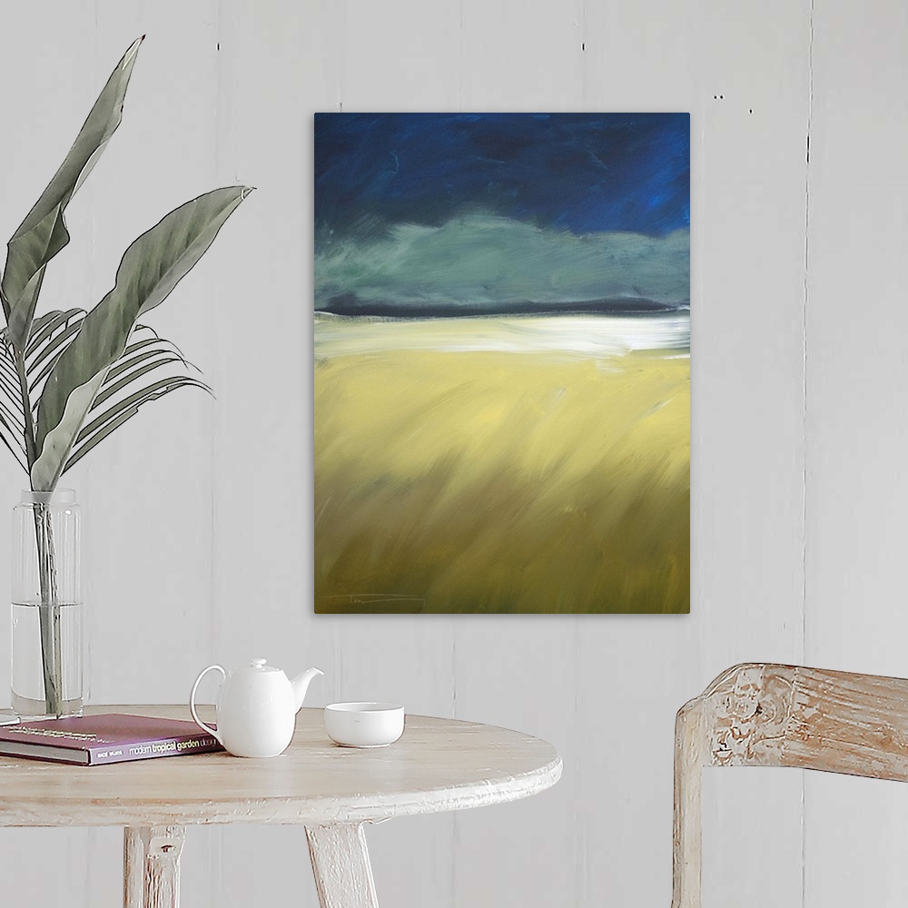 A farmhouse room featuring Contemporary landscape painting of dark storm clouds approaching on the horizon.