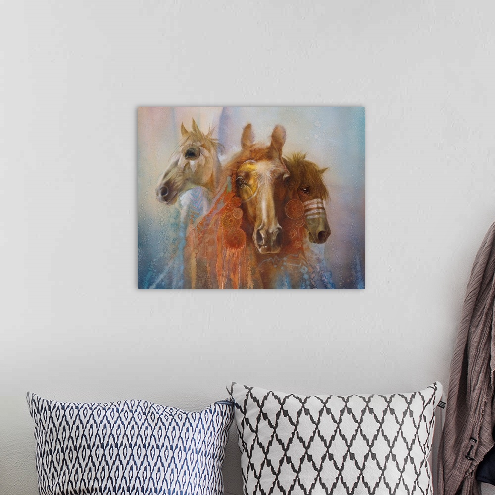 A bohemian room featuring A contemporary painting of three horse portraits with elaborate decorations and feathers hanging ...