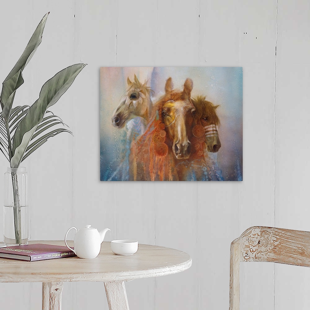 A farmhouse room featuring A contemporary painting of three horse portraits with elaborate decorations and feathers hanging ...