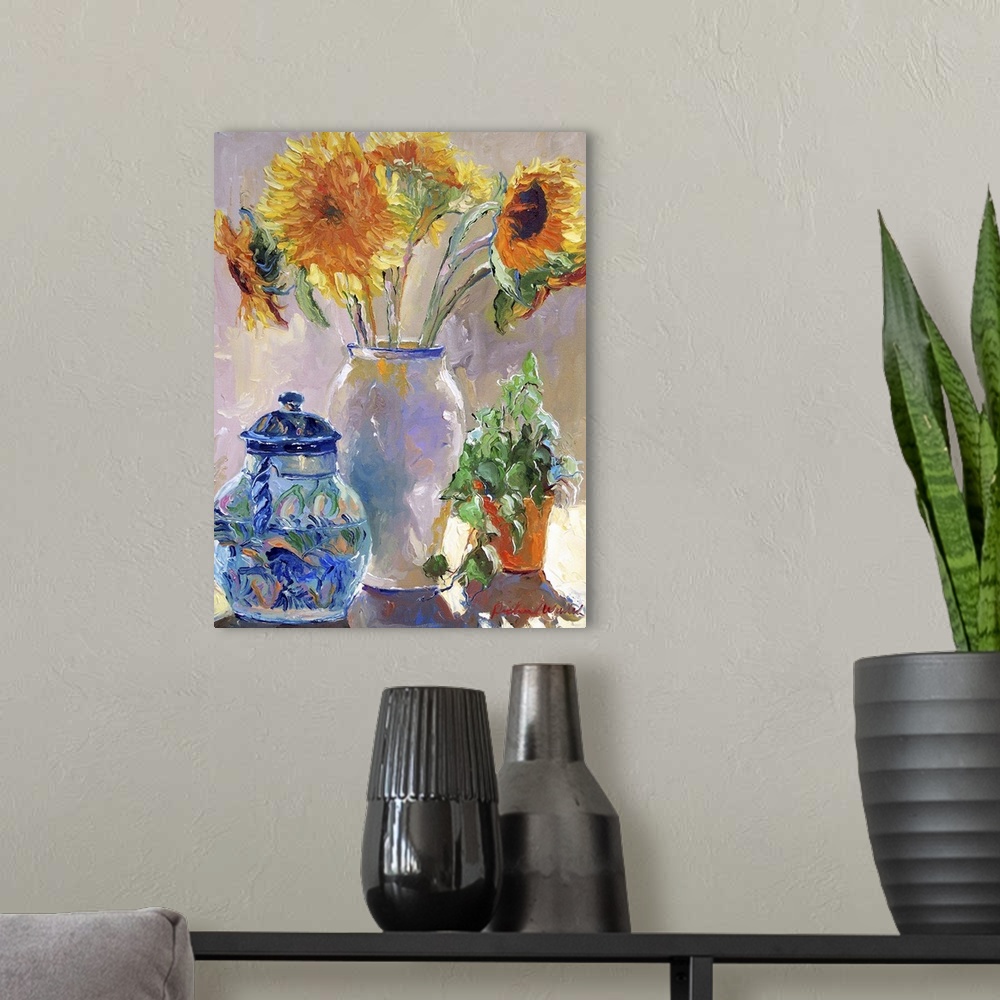 A modern room featuring Sunflowers in a white vase.