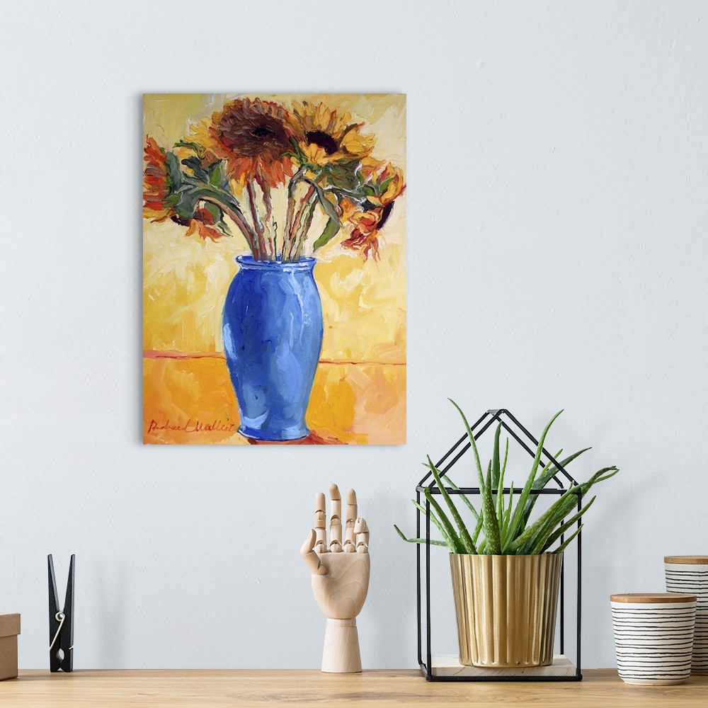 A bohemian room featuring Contemporary colorful painting of sunflowers in a blue vase.