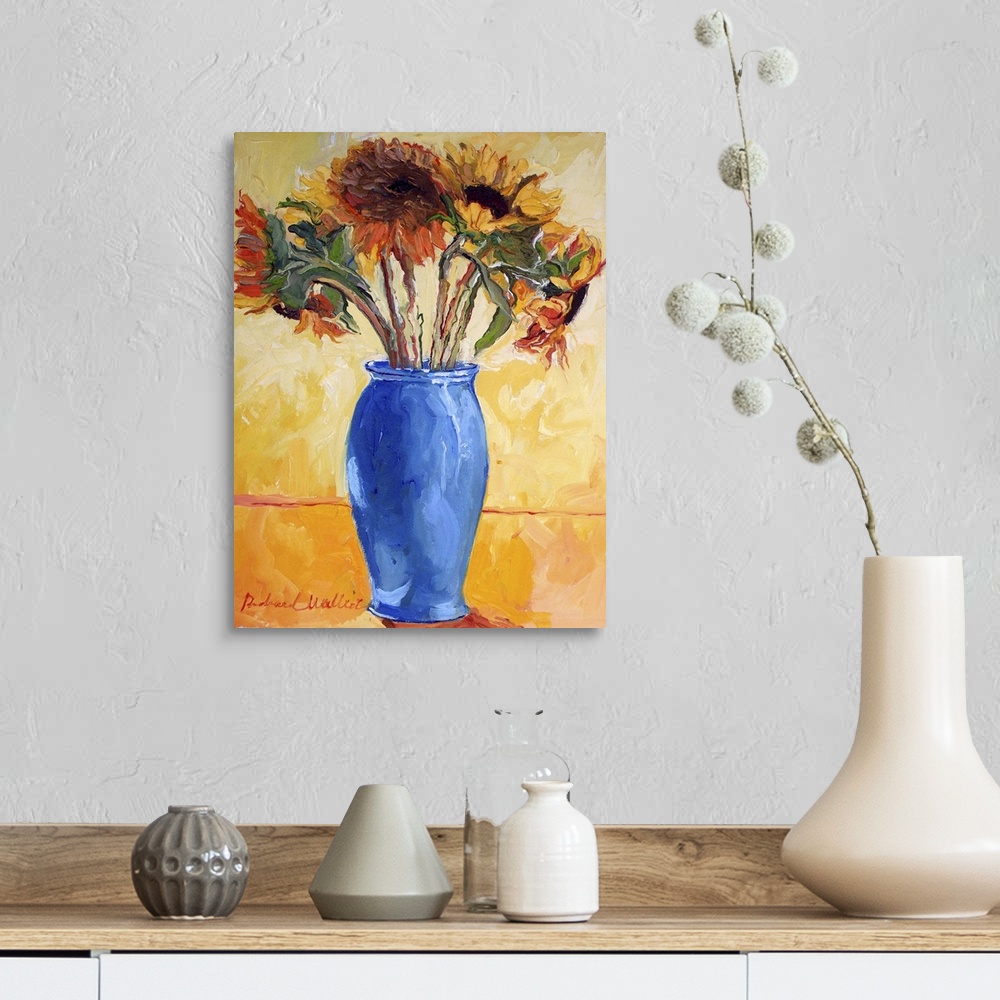 A farmhouse room featuring Contemporary colorful painting of sunflowers in a blue vase.