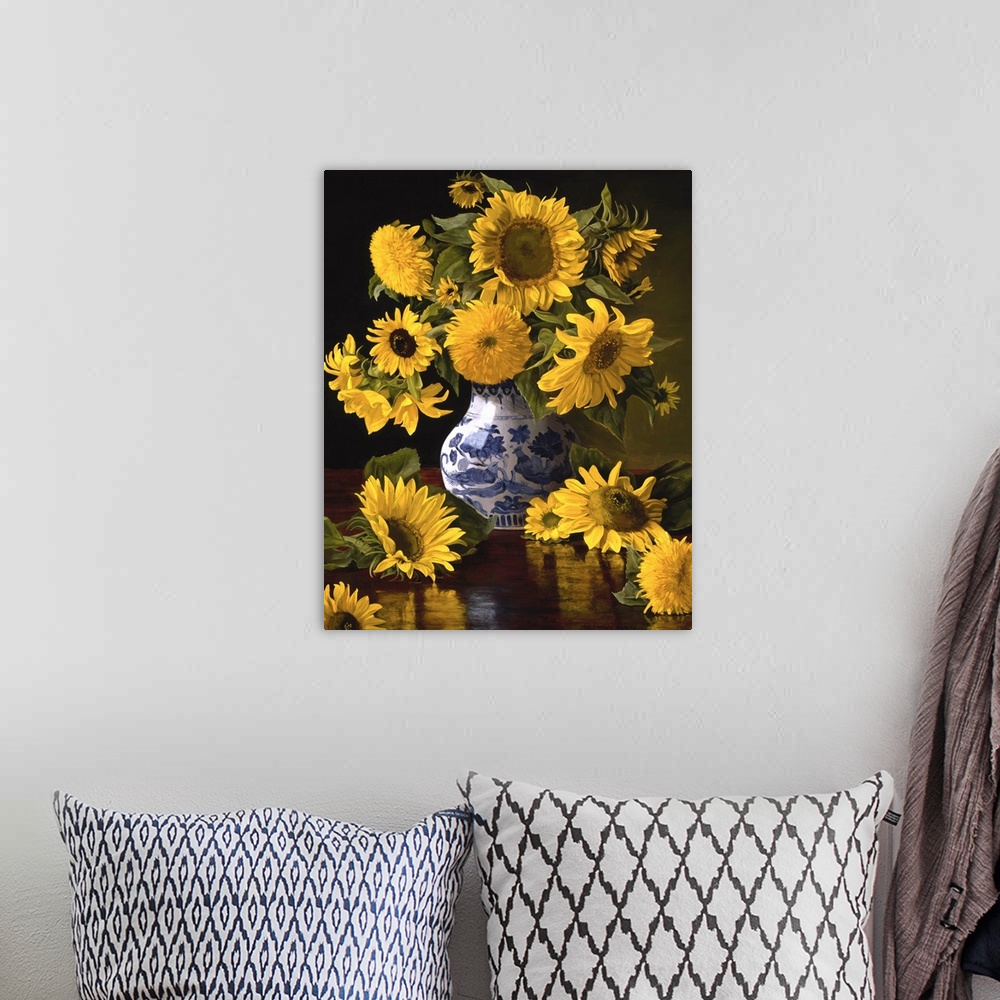 A bohemian room featuring Contemporary still-life painting of big yellow sunflowers in a Chinese vase.