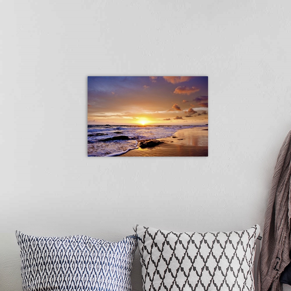 A bohemian room featuring A photograph of a seascape seen from a beach at sunset.