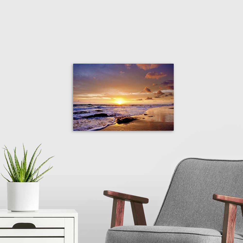A modern room featuring A photograph of a seascape seen from a beach at sunset.
