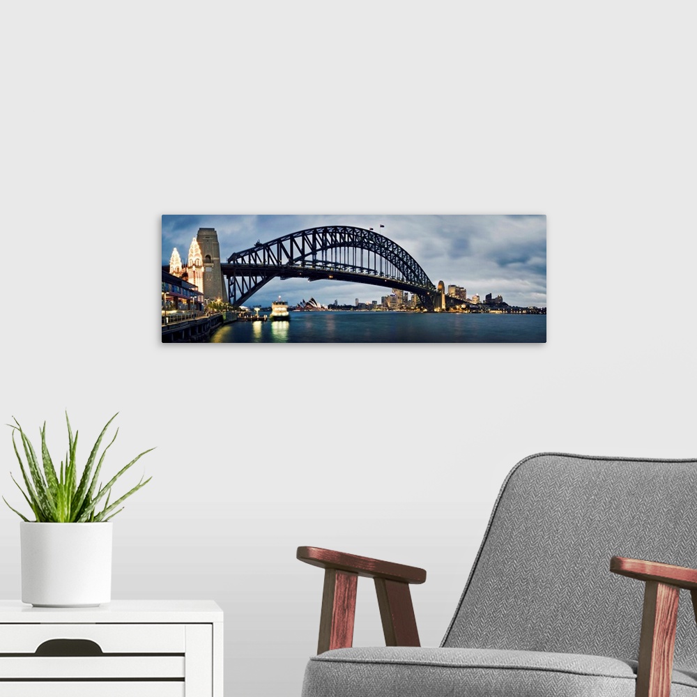 A modern room featuring A photograph of the Sydney harbor bridge in Australia.