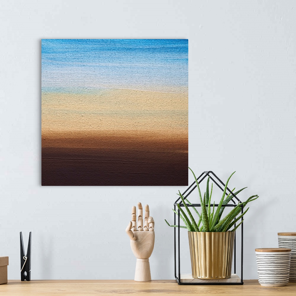 A bohemian room featuring Contemporary color block painting resembling a sunset.
