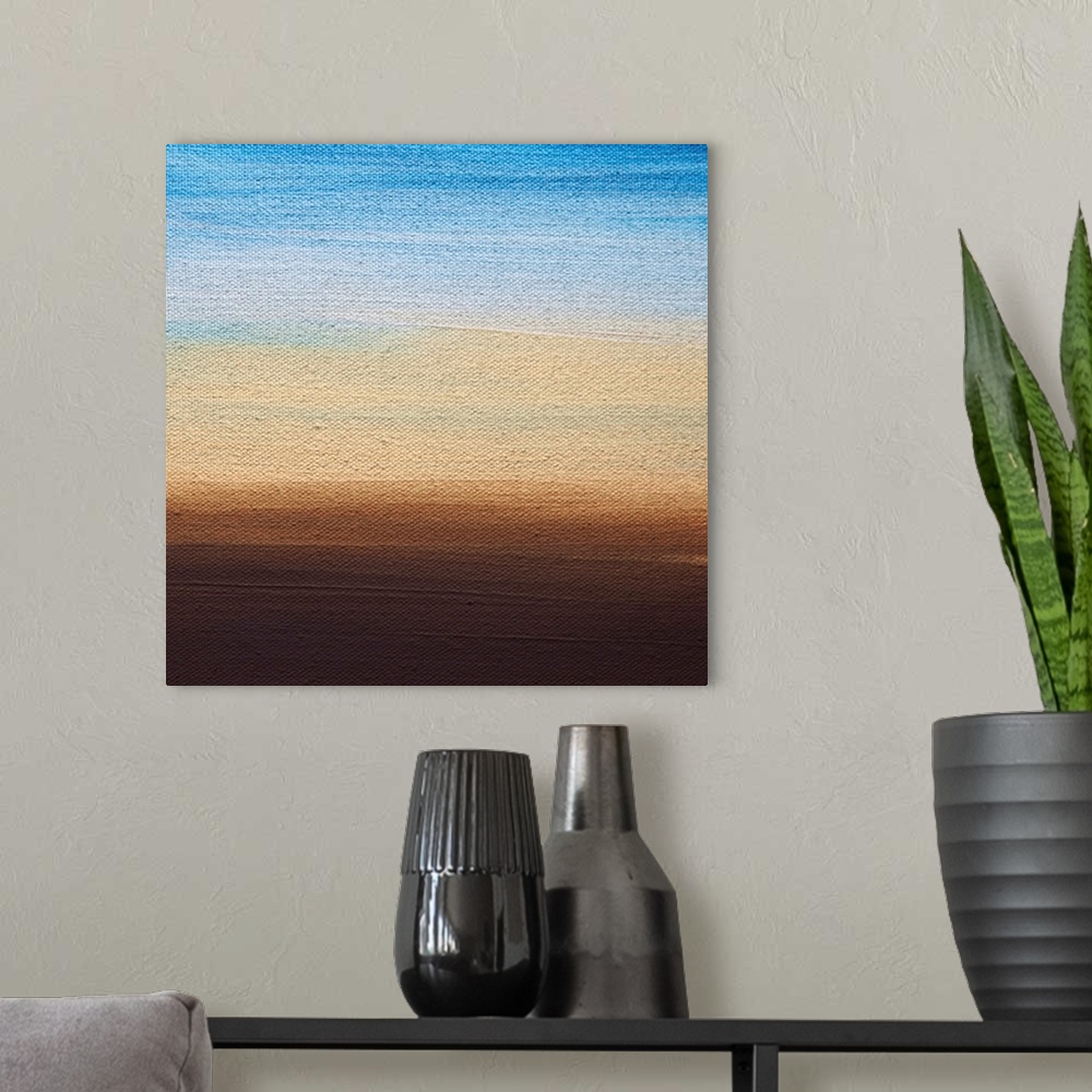 A modern room featuring Contemporary color block painting resembling a sunset.