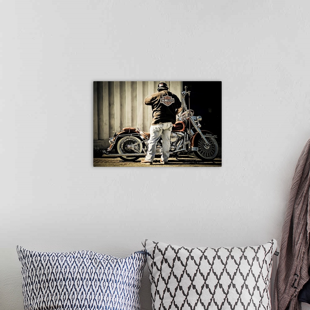 A bohemian room featuring Biker with his motorcycle