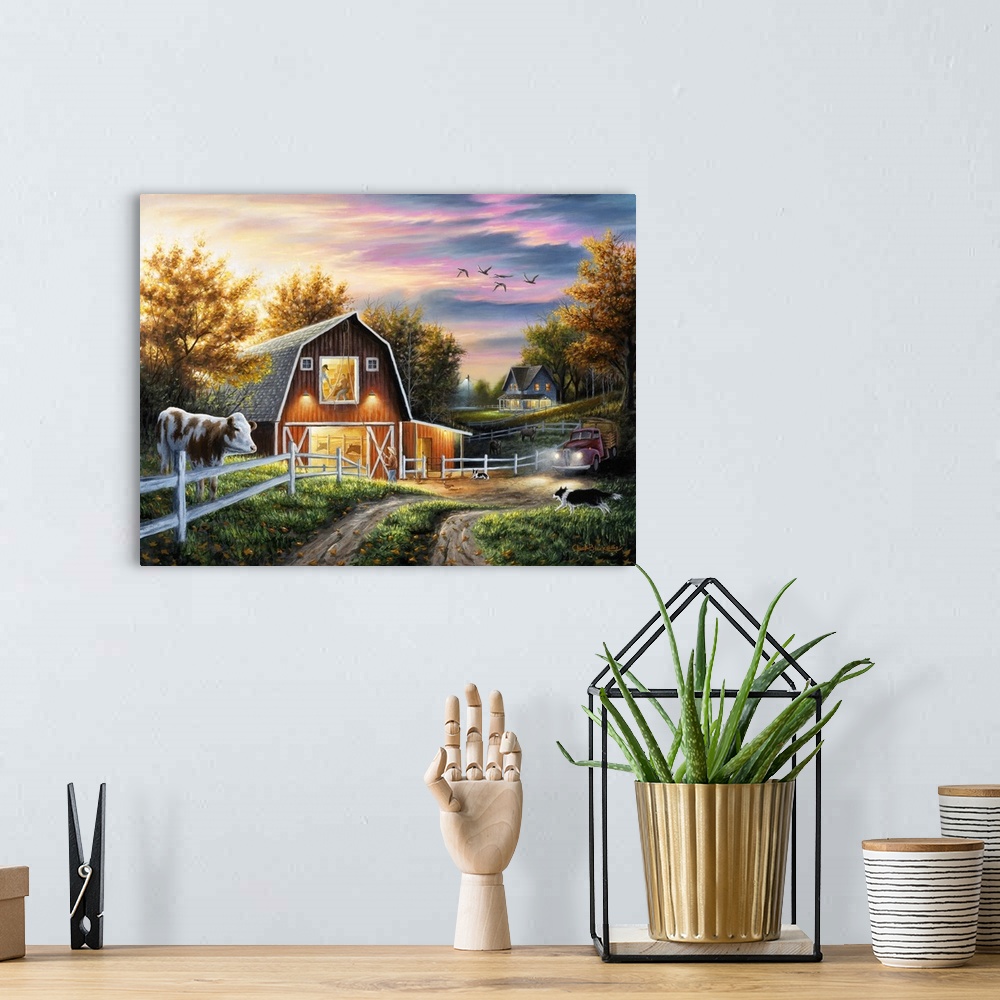 A bohemian room featuring Contemporary painting of a barn lit up at night under a beautiful sunset.