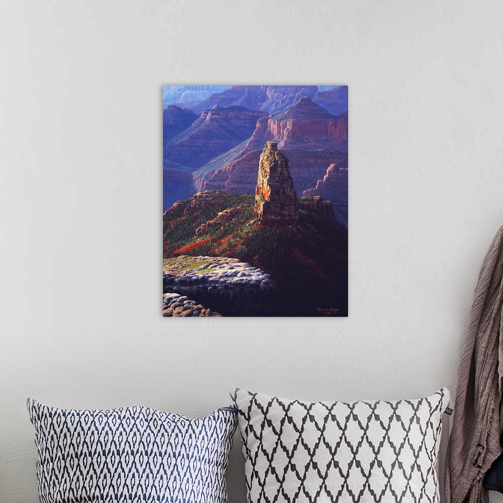 A bohemian room featuring A tall natural landmark stands against the backdrop of the canyon walls.