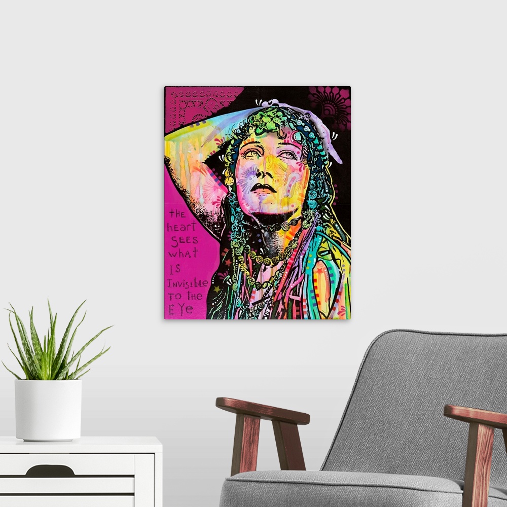 A modern room featuring Pop art style artwork of a colorful woman with graffiti like designs on a bright magenta backgrou...