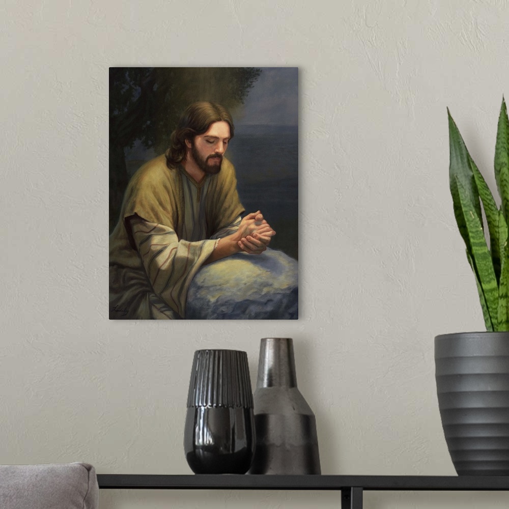 A modern room featuring Jesus praying.