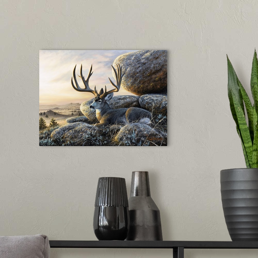 A modern room featuring Contemporary wildlife painting of a buck with large antlers resting next to large boulders.