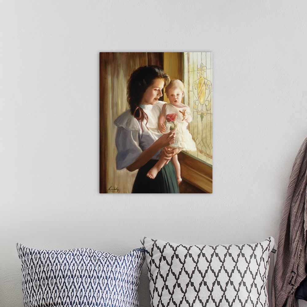 A bohemian room featuring Mother holding her baby and showing her a rose.