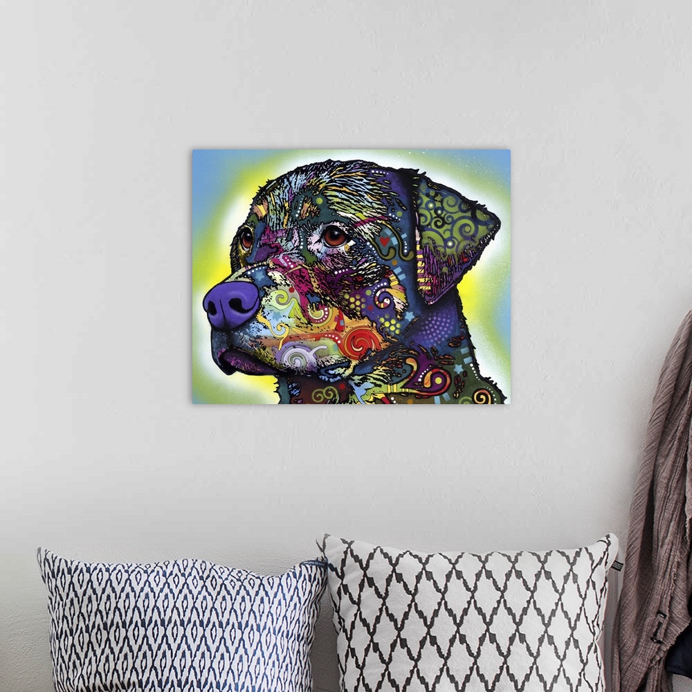 A bohemian room featuring Contemporary artwork of a dog's outline that is filled with several multicolored patterns.