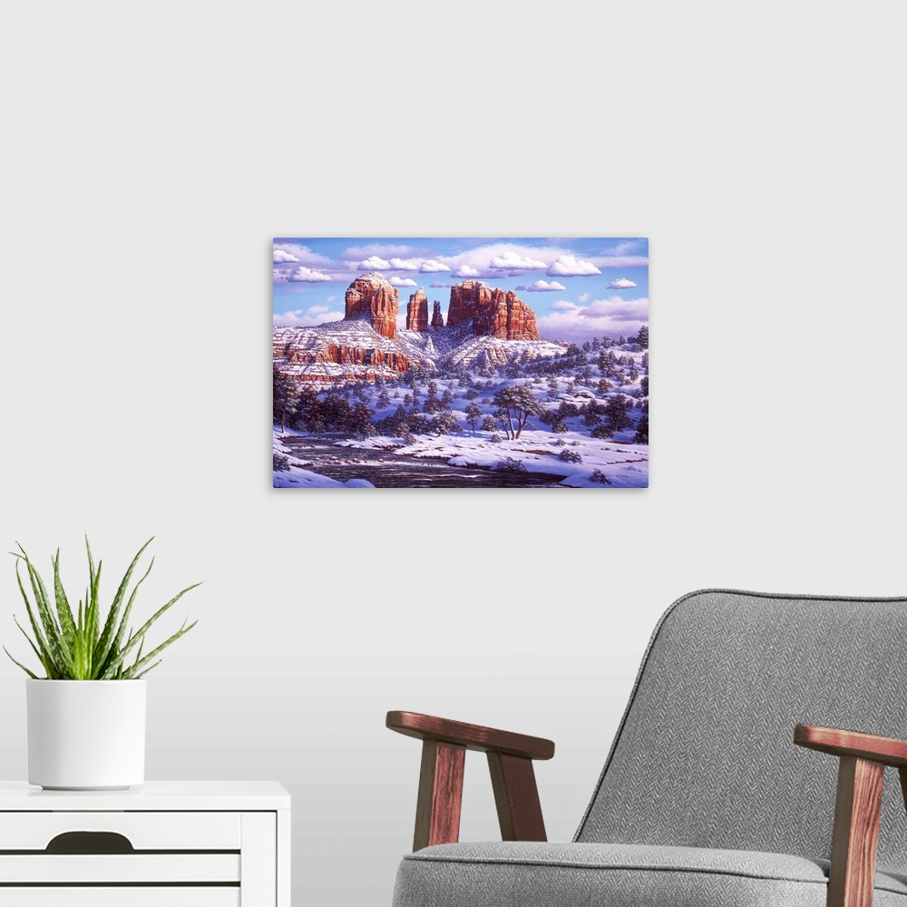 A modern room featuring Red Rocks in the winter, covered in snow.