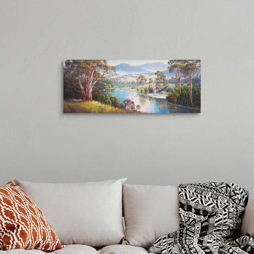 A bohemian room featuring Contemporary painting of a mountainous valley.