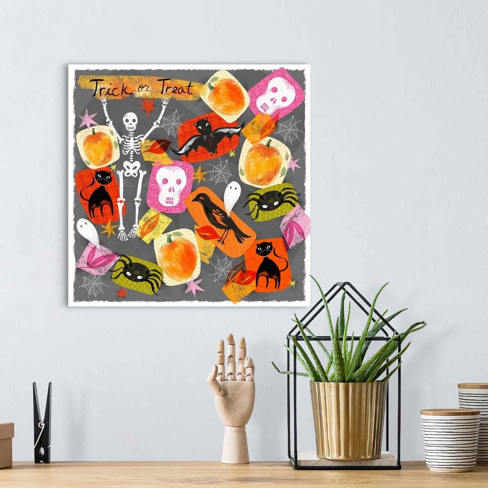 A bohemian room featuring Halloween themed children's artwork in vibrant colors.