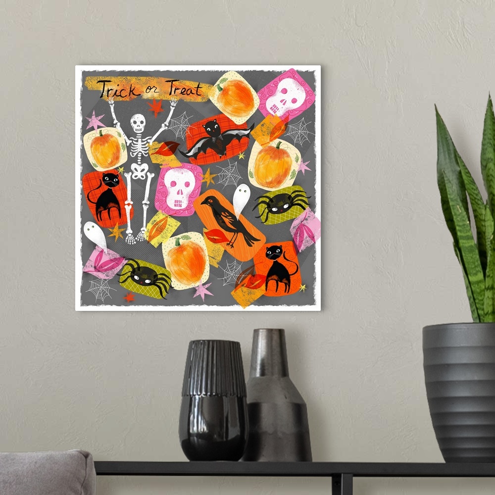 A modern room featuring Halloween themed children's artwork in vibrant colors.