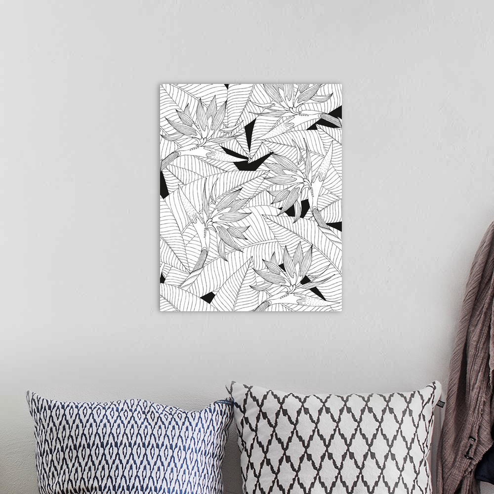 A bohemian room featuring Black and white line art of birds of paradise flowers with a leafy background.