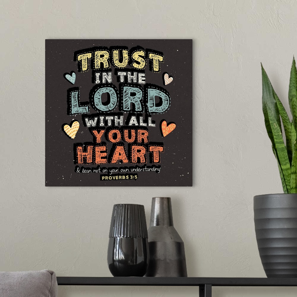 A modern room featuring Religious themed typography artwork.