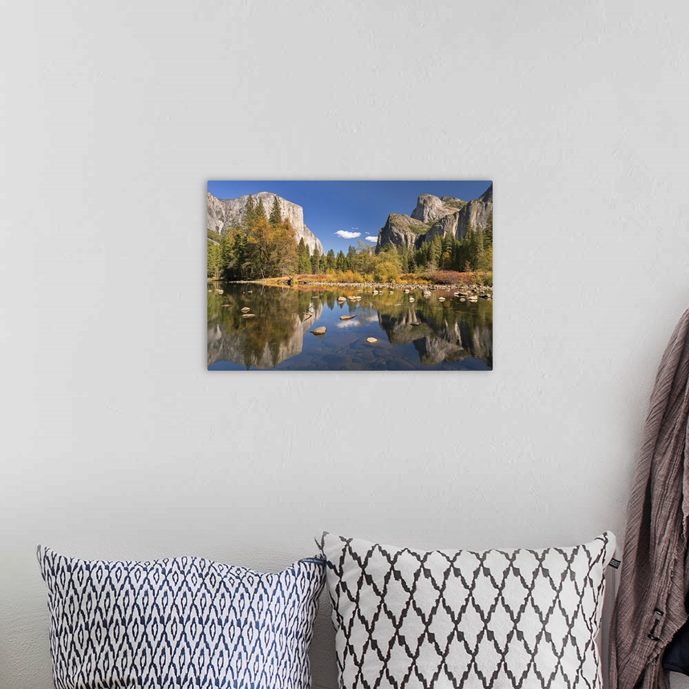 A bohemian room featuring El Capitan and Bridalveil Falls in Yosemite reflected in the clear water of the River Merced.