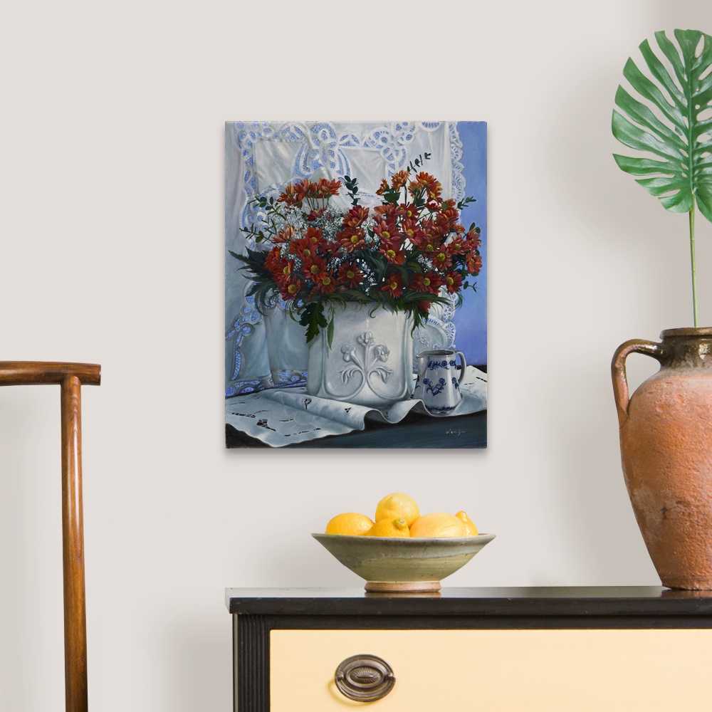 A traditional room featuring Contemporary still life painting of an elegant vase of red flowers.