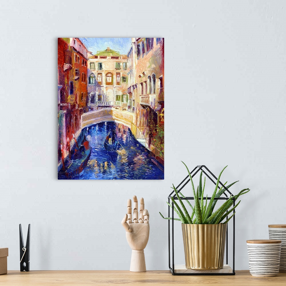 A bohemian room featuring A canal in Venice with gondolas on it and houses on either side.