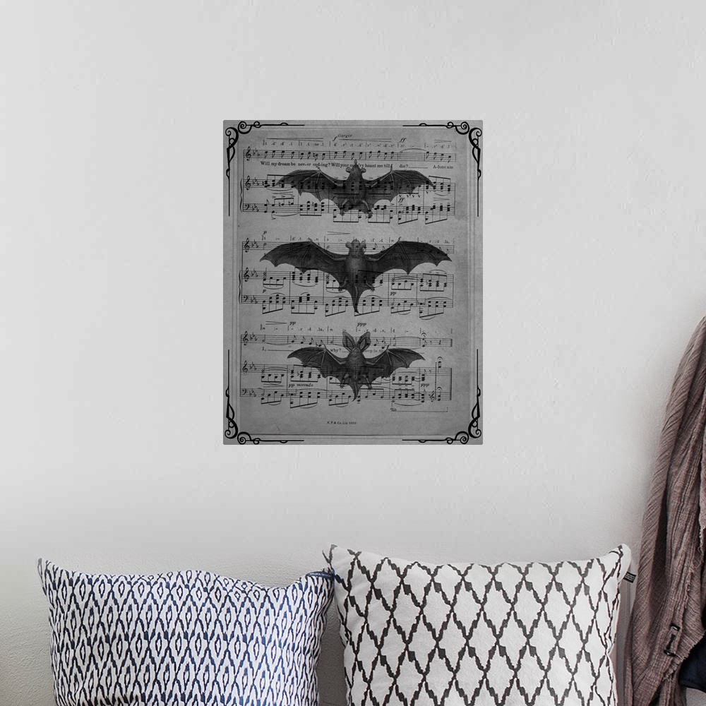 A bohemian room featuring Black and white vintage sheet music with three bats on top.