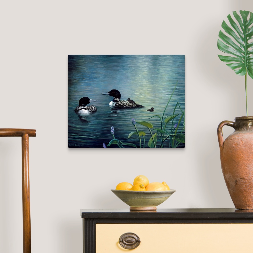 A traditional room featuring Contemporary artwork of virginia loons and chicks in the water.