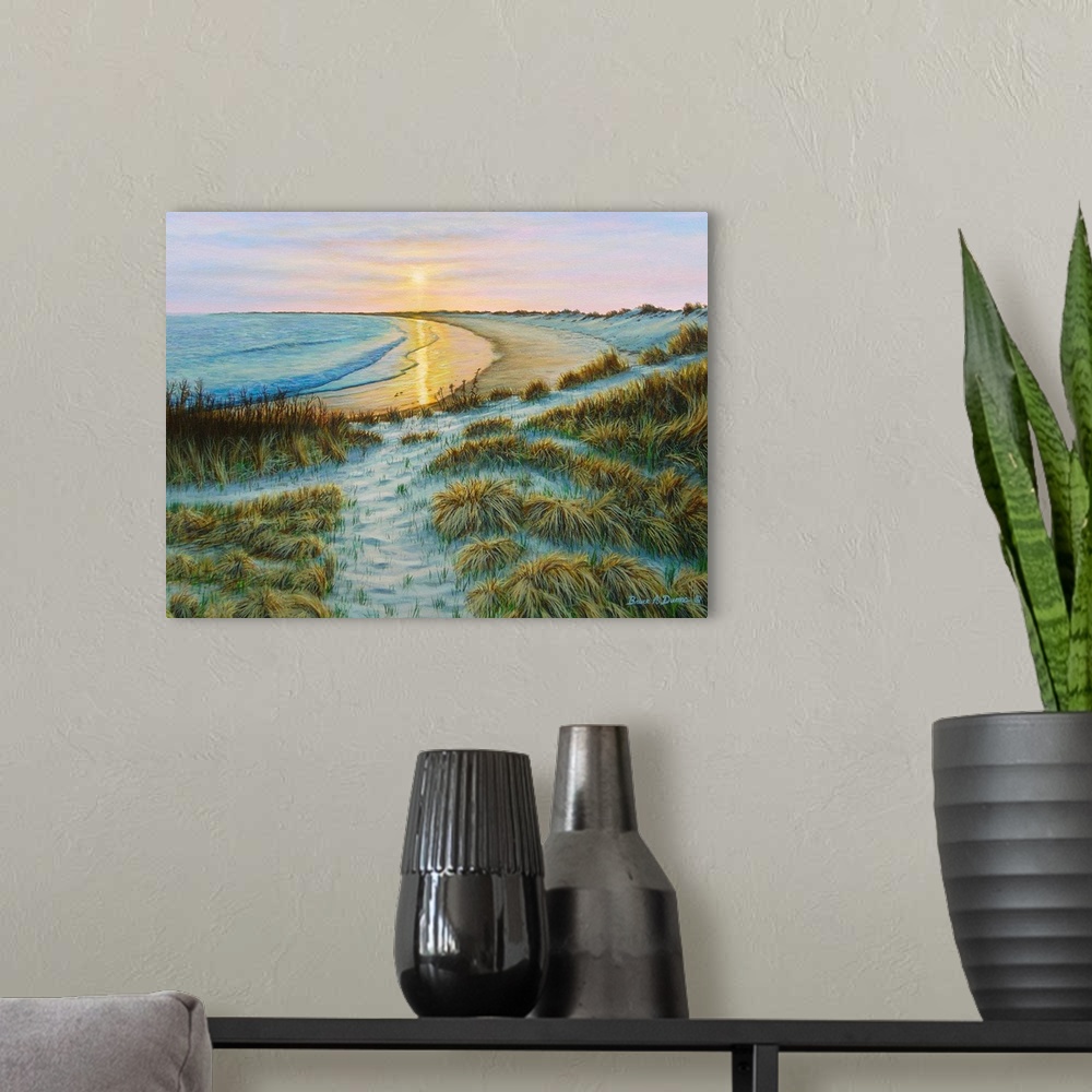 A modern room featuring Contemporary artwork of a beach and ocean scene at sunset.