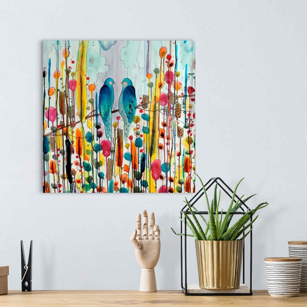 A bohemian room featuring Colorful contemporary watercolor painting of two blue birds perched on a branch against a colorfu...