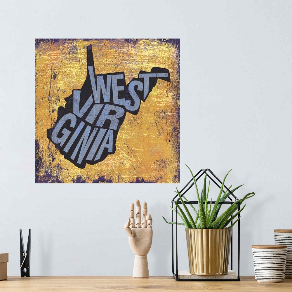 A bohemian room featuring Contemporary typography art of a state outline against a grungy distressed background.