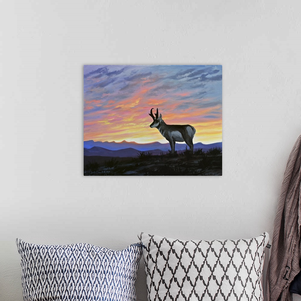 A bohemian room featuring Contemporary painting of a deer standing outside with a beautiful sunset in the sky over the moun...