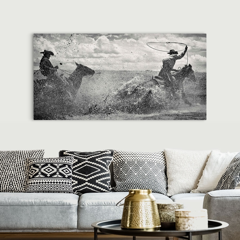 A bohemian room featuring 2 Ropers splashing up mud and water